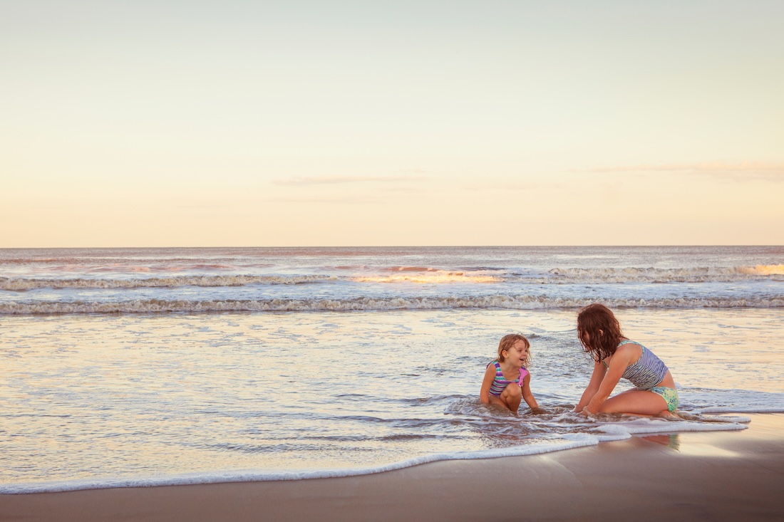 Children playing at the beach on Oak Island NC